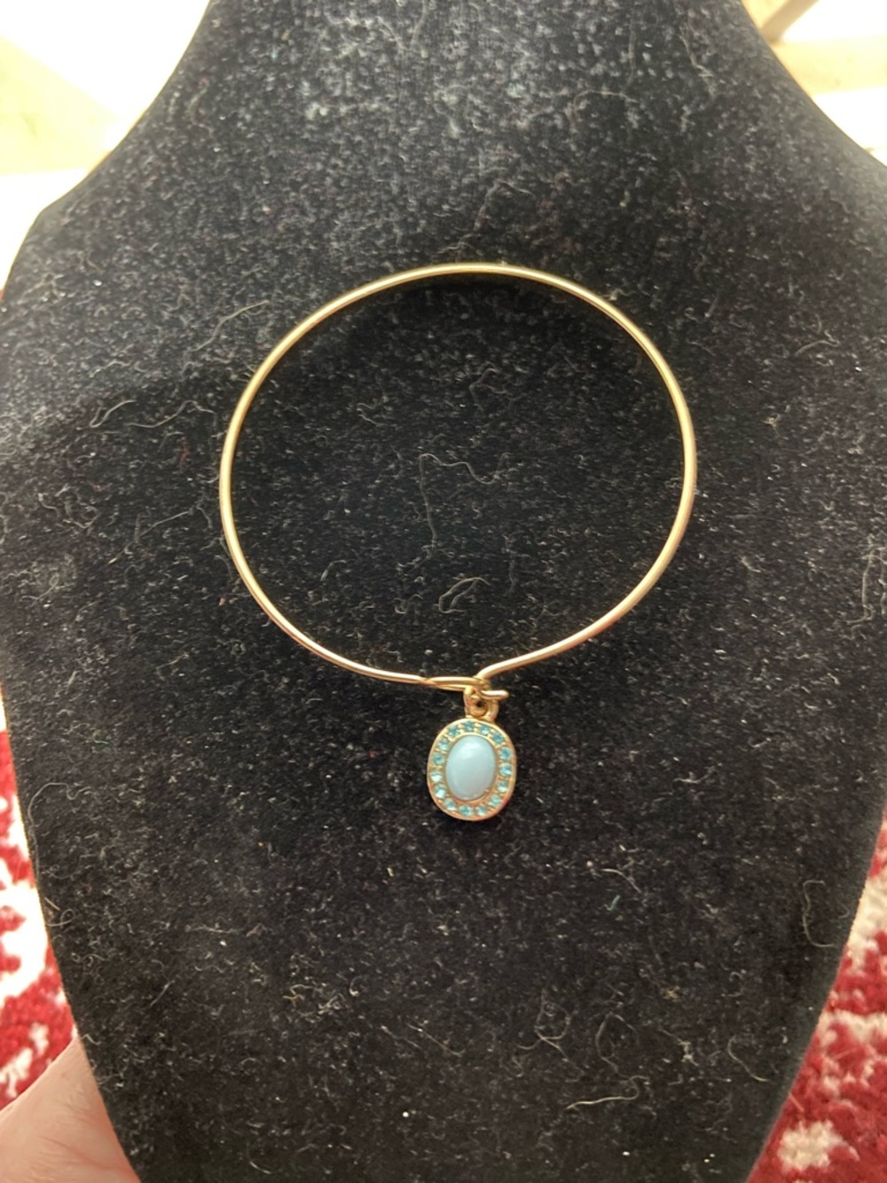 Gold Tone Bangle Bracelet with Blue Oval Charm